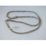 A long heavy flat link silver necklace