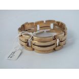 A LARGE FANCY LINK PANEL BRACELET SET IN 9CT - 33.4gms