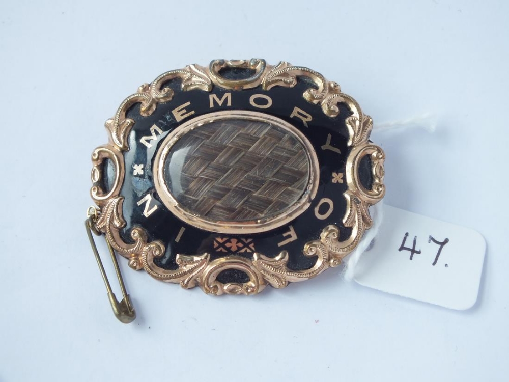 A large antique memorial brooch with plaited hair