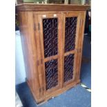 HEAVY CARVED MEXICAN WOOD STORAGE CUPBOARD WITH WROUGHT IRON FRONT, DRAWERS & SHELVING