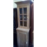 NARROW STRIPPED PINE CUPBOARD PARTLY GLAZED