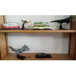 2 SHELVES CONTAINING THREE AIRPLANES INCL; AN AVRIO VULCAN, TWO TRAMS & A GLOBE MASTER C17 -