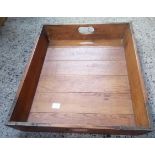 A WOODEN BREAD TRAY WITH RE-ENFORCED CORNERS & TWO HAND HOLDS