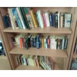 THREE SHELVES OF MAINLY PAPERBACK BOOKS - SMOKE AFFECTED