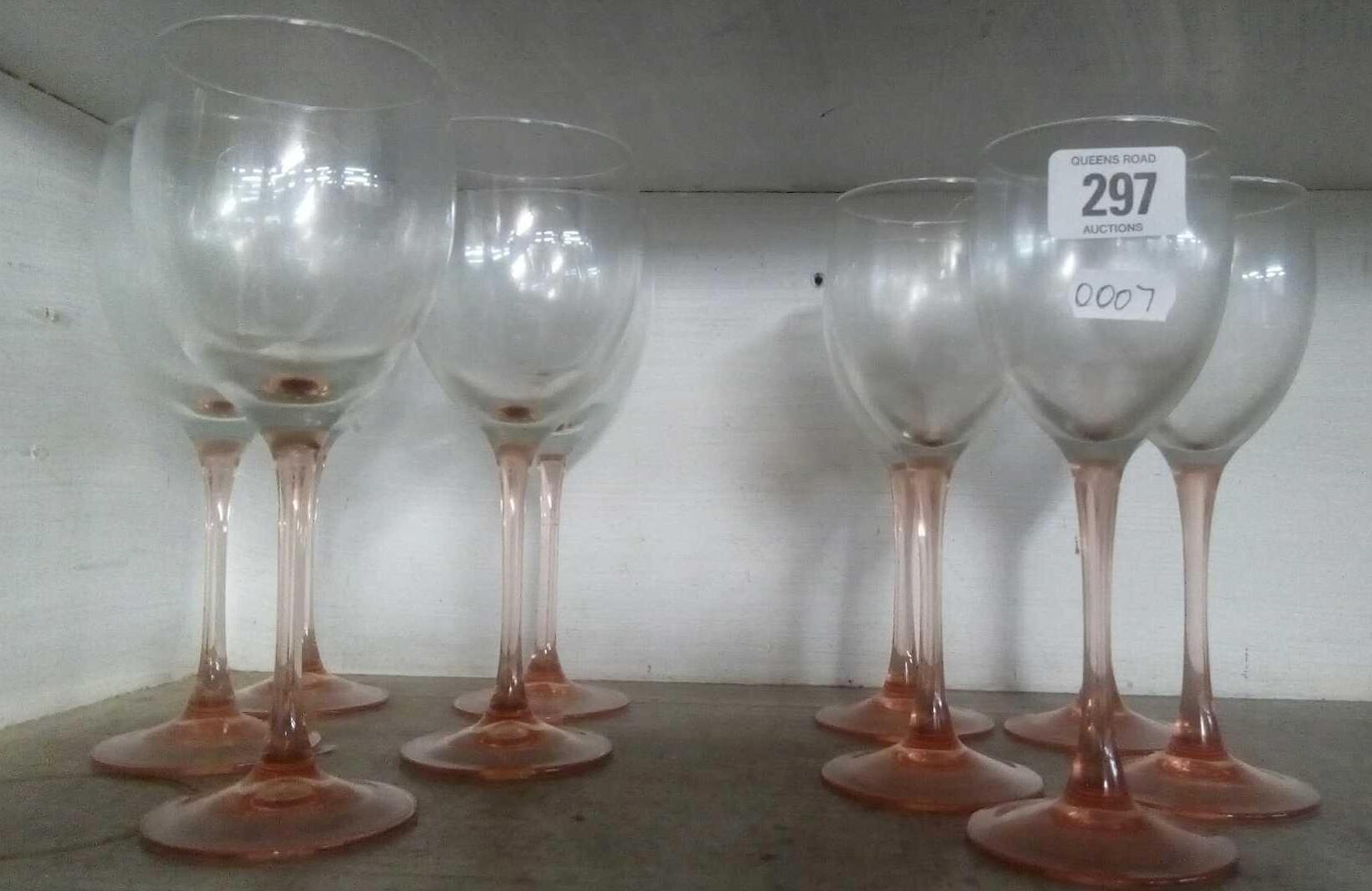 SHELF OF COLOURED WINE GLASSES