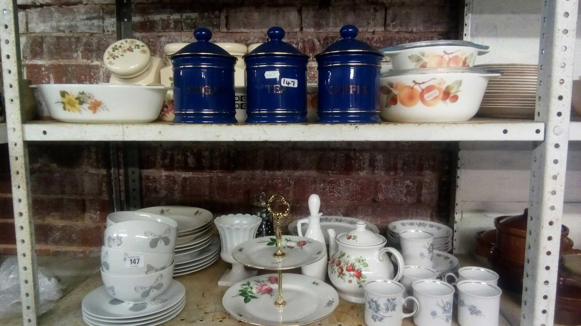 TWO SHELVES OF MIXED CHINAWARE INCL; KITCHEN STORAGE JARS, PYREX CASSEROLE DISHES