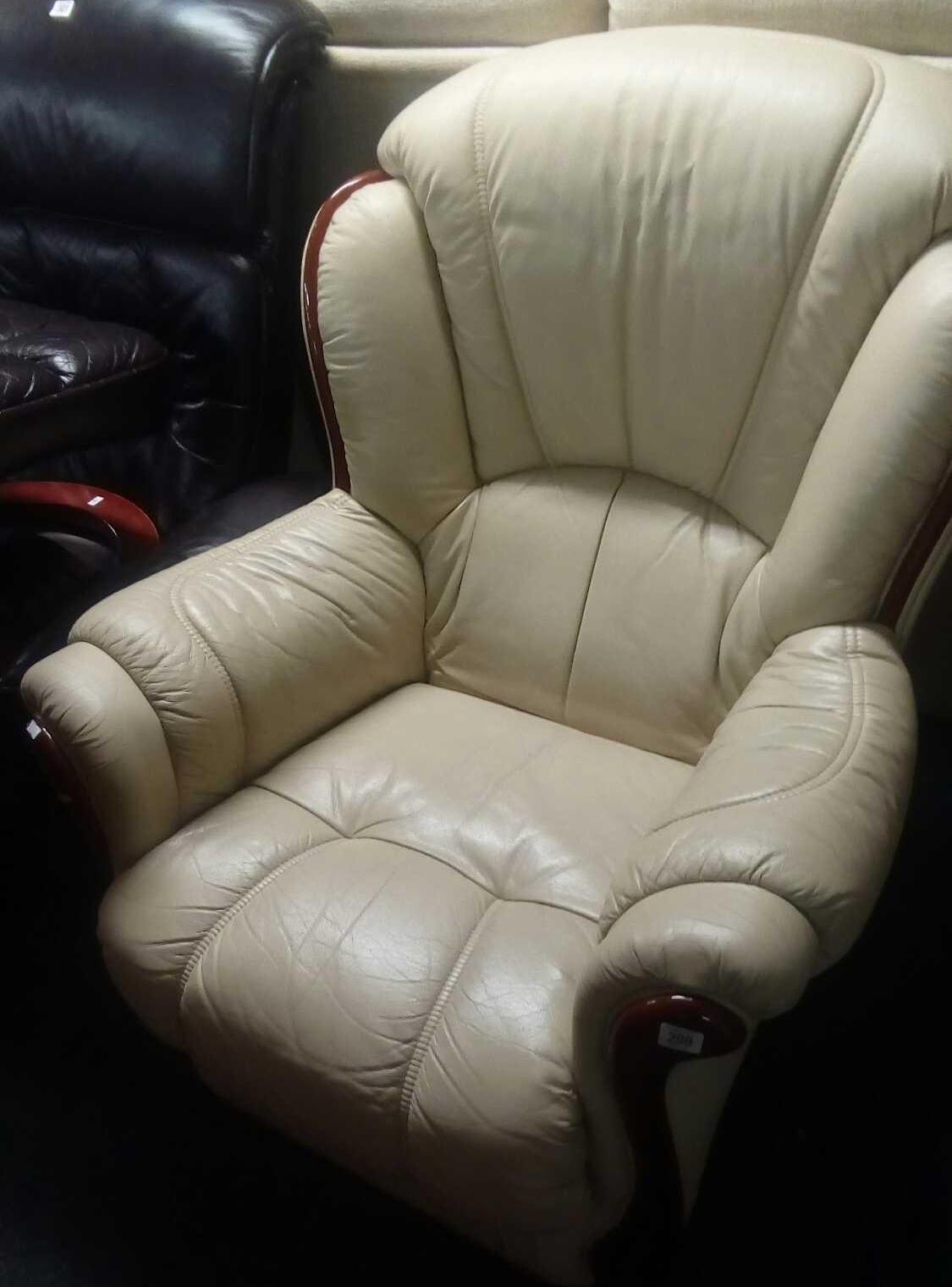 CREAM COLOURED LEATHERETTE ARMCHAIR