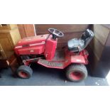 A WESTWOOD MODEL 10-12 RIDE ON TRACTOR (NEEDS BATTERY & SOLD AS SEEN)
