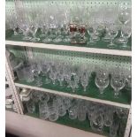 THREE SHELVES OF FINE QUALITY CUT GLASS WARE & OTHER GLASSES