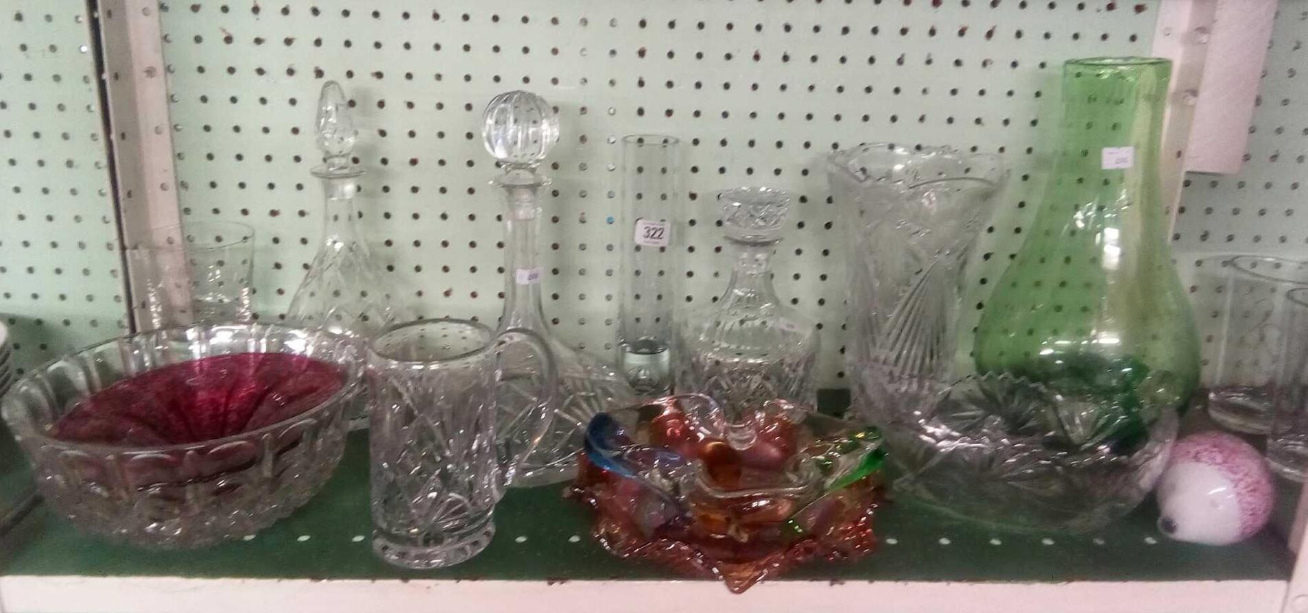 SHELF OF GLASS DECANTERS BOWLS ETC