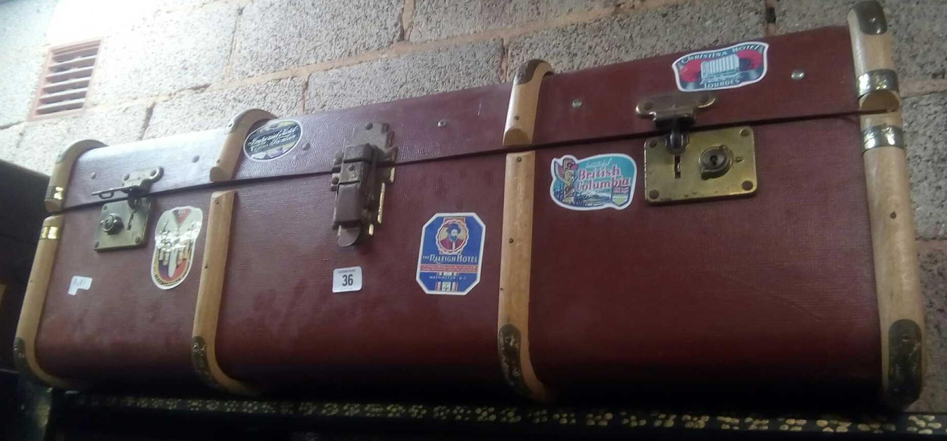 BROWN WOOD BOUND VINTAGE TRAVEL TRUNK WITH MANY SHIPPING & HOTEL LABELS