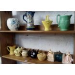 TWO SHELVES OF CHINA TEA POTS, VASES ETC