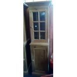 NARROW STRIPPED PINE CUPBOARD PARTLY GLAZED