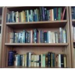 THREE SHELVES OF MAINLY PAPERBACK BOOKS - SMOKE AFFECTED