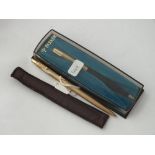 Rolled gold Parker ball point pen in felt case and one in plastic case