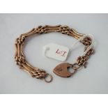 Three bar gate bracelet with padlock clasp in 9ct - 11gms
