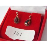 Boxed 9ct teardrop earrings with red stone