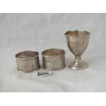 Two napkin rings and a 1922 egg cup