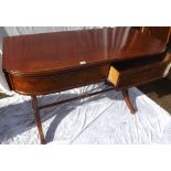 Regency mahogany writing table with bowed front and two drawers. Later trestle base - 50" wide