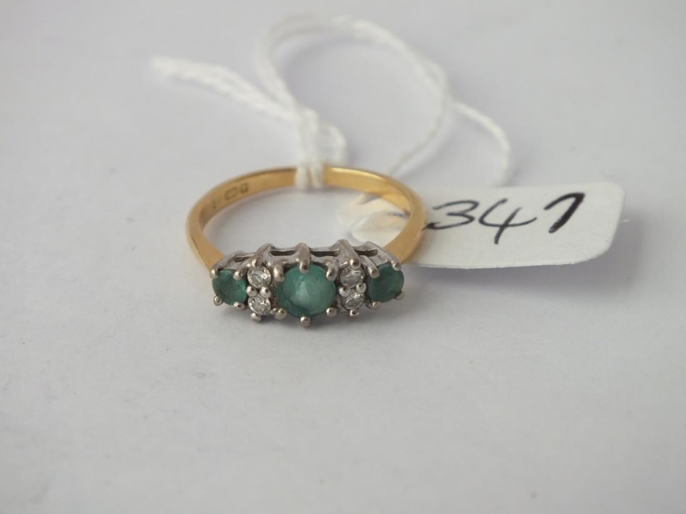 Seven stone emerald and diamond ring set in 18ct gold - size O - 3.6gms