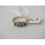 Seven stone emerald and diamond ring set in 18ct gold - size O - 3.6gms