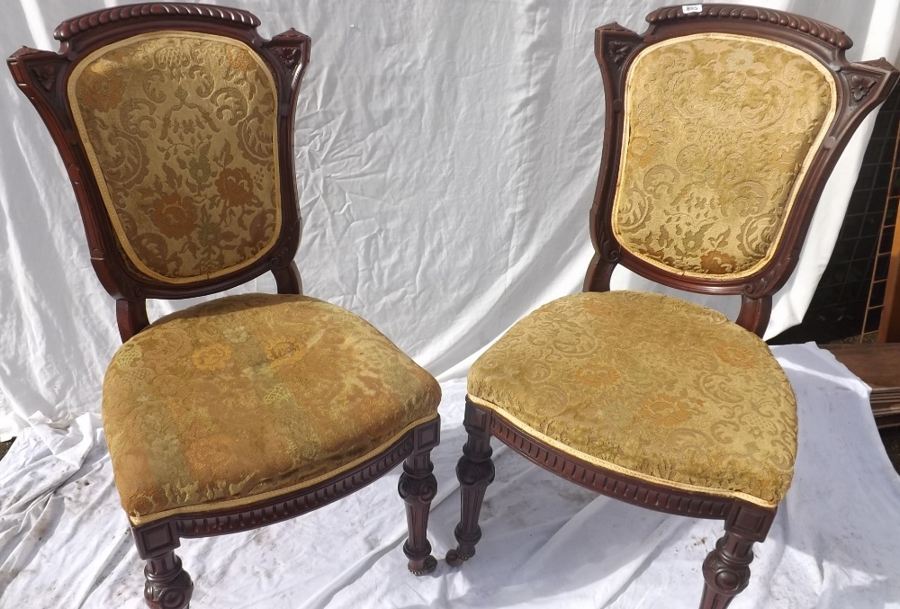 Set of ten Victorian walnut chairs on carved and fluted legs