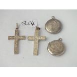 Two silver lockets and two silver cross pendants