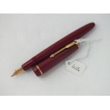 Red screw-cased Parker fountain pen with 14ct gold nib