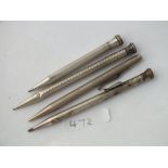 One silver and three silver plated propelling pencils
