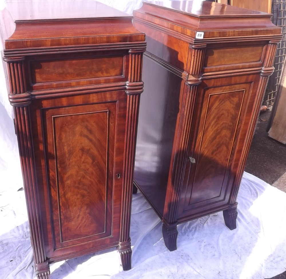 Pair of fine quality regency period mahagony pedestals with figured doors and fitted interior -