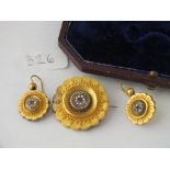 CASED SET ANTIGUE GOLD TARGET BROOCH AND MATCHING EARRINGS