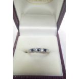 A SAPPHIRE 7 STONE MOUNTED RING IN 9ct