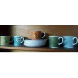 FIVE SUSIE COOPER DECORATED COFFEE CUPS & SAUCERS