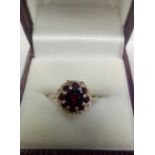 A GARNET RING SET IN 9ct