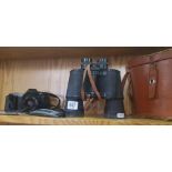 PAIR OF OMEGA 10 X 50 BINOCULARS WITH CASE & A CANNON T50 CAMERA