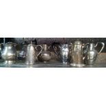 SHELF WITH VARIOUS PLATED WATER JUGS