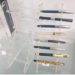 TWO PERSPEX PEN RACKS - 1 CONTAINING 8 VARIOUS INK PENS