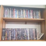 TWO SHELVES OF DVD'S