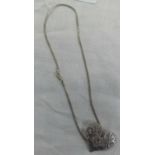 A SILVER NECK CHAIN WITH HEART SHAPED PENDANT