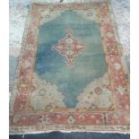 ORANGE & GREEN GROUND RUG WITH TASSELED ENDS