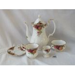 A matching coffee set of coffee pot and cover, 11 cups and 12 saucers and an egg cup.