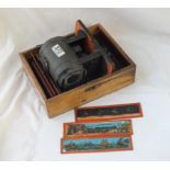 A magic lantern machine with oblong glass slides (9)