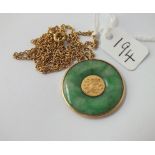 A Chinese jade pendant & chain in 18ct gold - 10.3gms