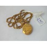 A gold oval locket on 9ct belcher link chain