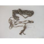 A bag of 2 silver chains, a brooch & tassel - 65gms