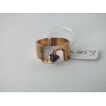 A unusual amethyst ring in 9ct - size V - 6.8gms