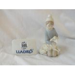 A Lladro girl with sheep, 4" high & a Lladro display stand.