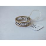 A silver and gold Celtic style ring - size Q