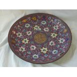 A large Chinese enamel charger, decorated with multicolour flowers. 16" diameter