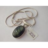 A silver stone set pendant necklace